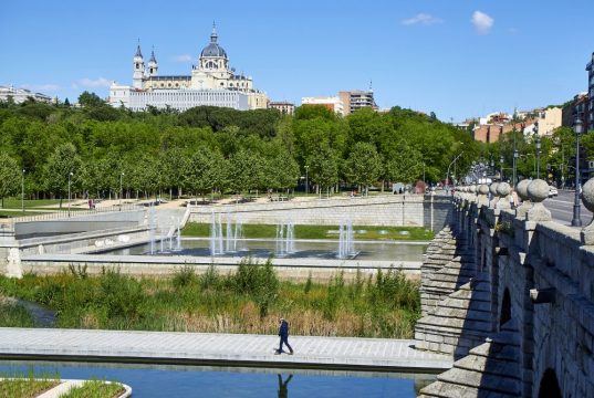 Madrid Río Park with Segovia Bridge and Almudena Cathedral in the background